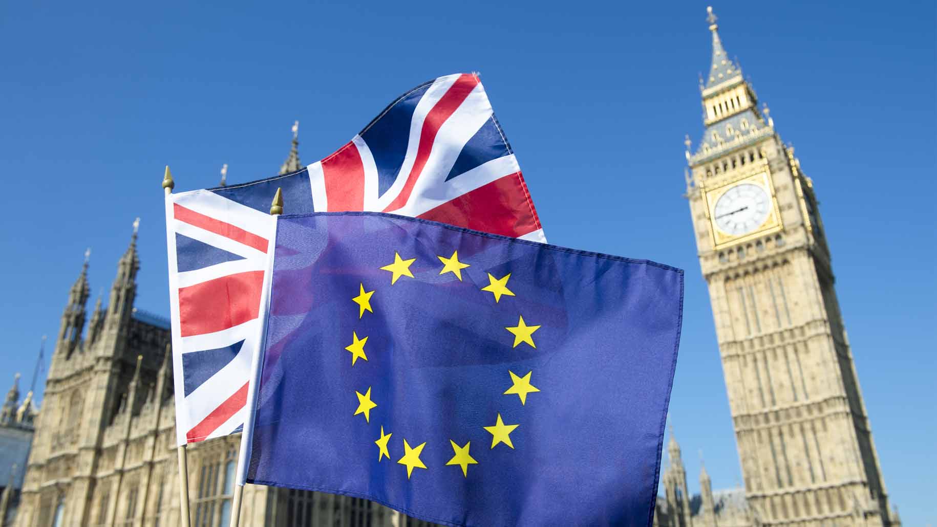 European Union and British Union Jack flag flying in front of Big Ben and the Houses of Parliament at Westminster Palace, London, in preparation for the Brexit EU referendum