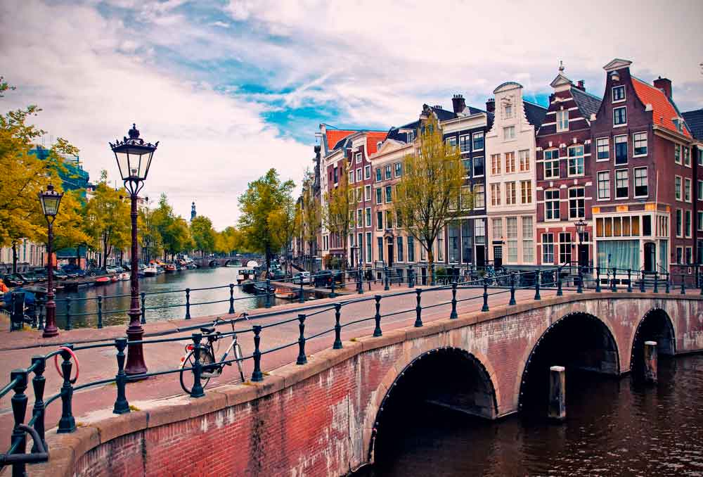 Bridge and river in Amsterdam with bikes