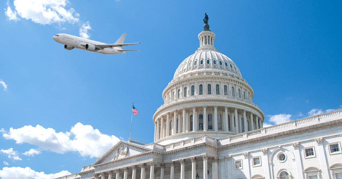 plane flies over US capitol building