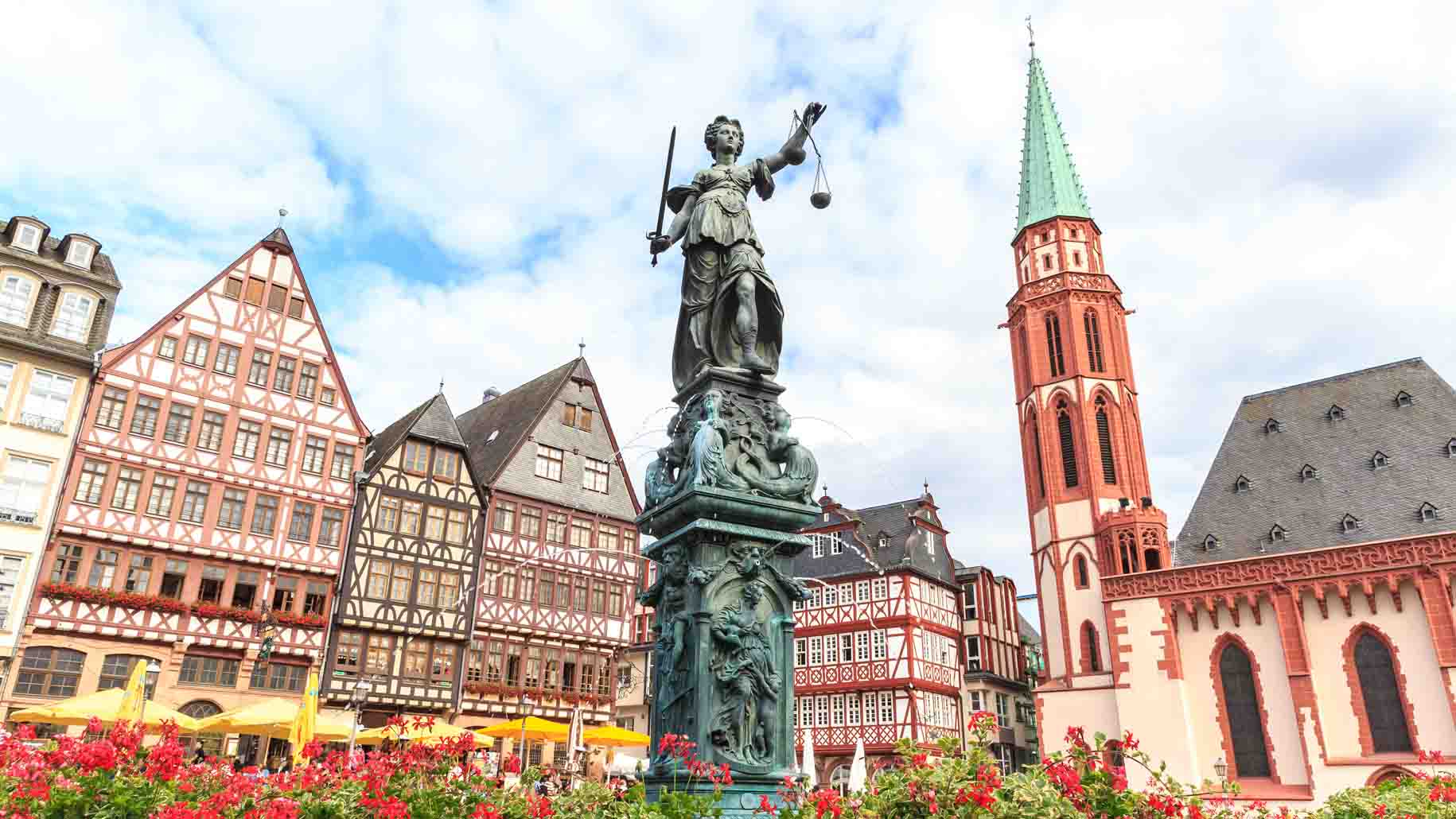 Old town square romerberg with Justitia statue in Frankfurt Germany